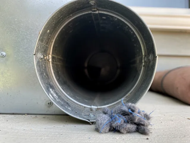 Yucaipa Dryer Vent Cleaning technician using specialized equipment to clear severe dryer vent blockage in Yucaipa